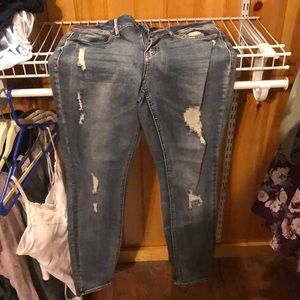 Distressed blue jeans